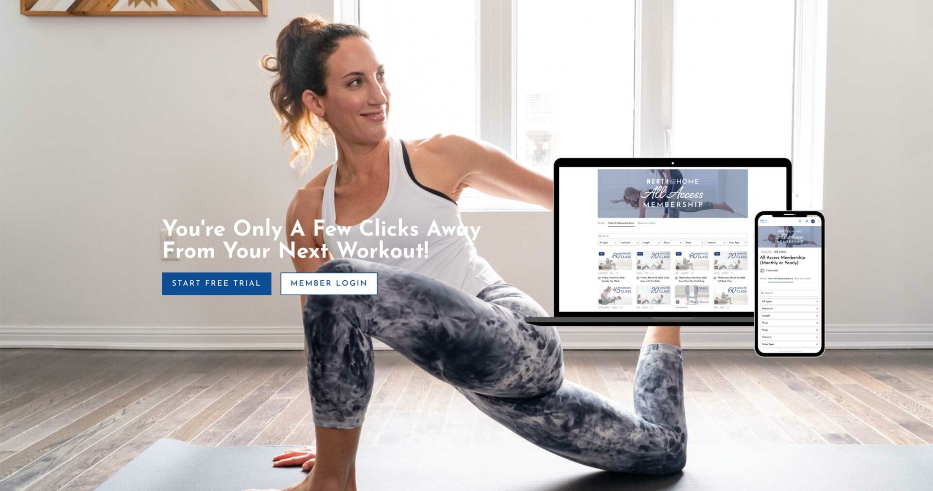 a woman sitting on a mat with a laptop